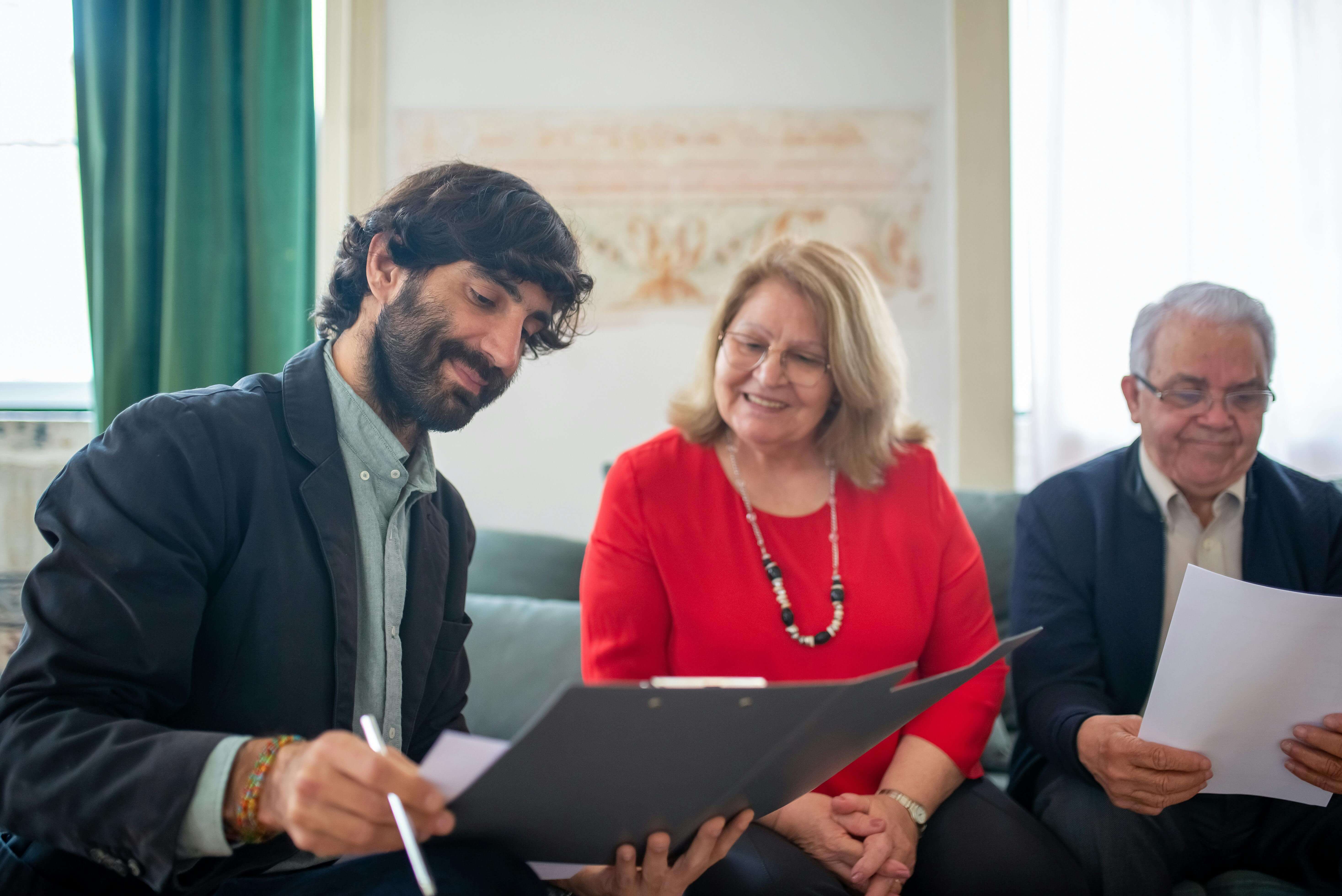 Insurance advisor reviewing Medicare options with senior couple