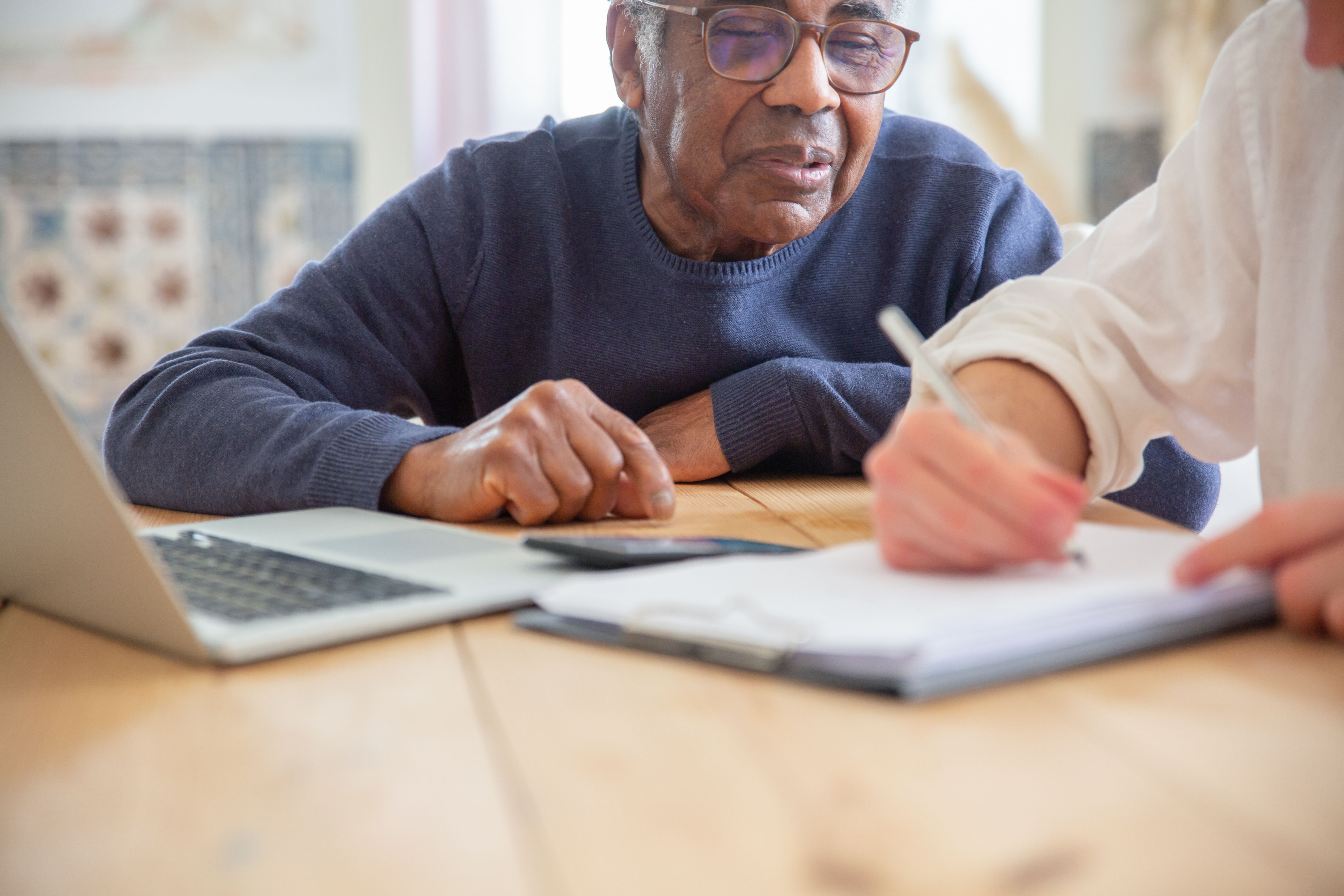 Senior man reviewing Medicare options with advisor