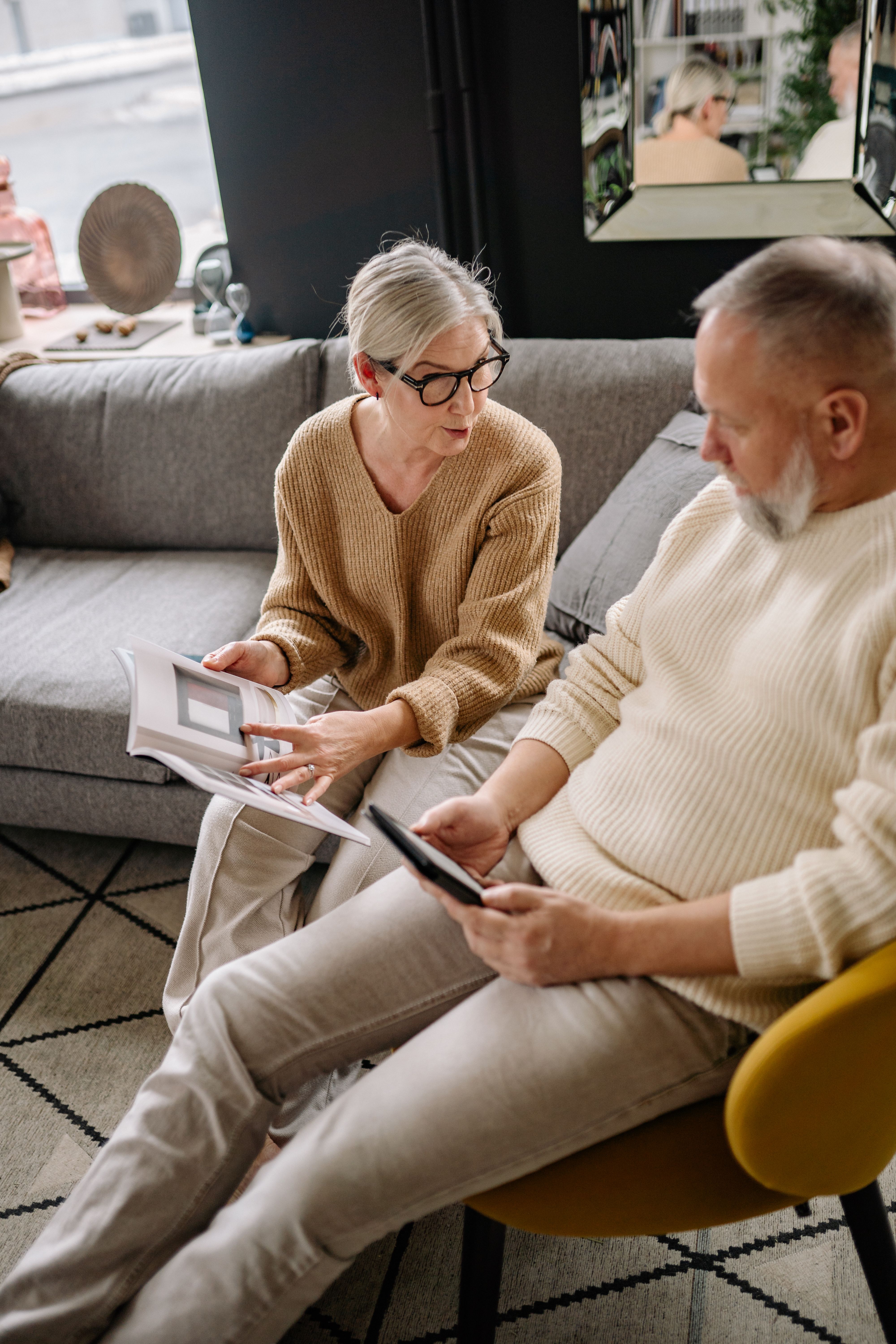 Senior couple reading and relaxing at home